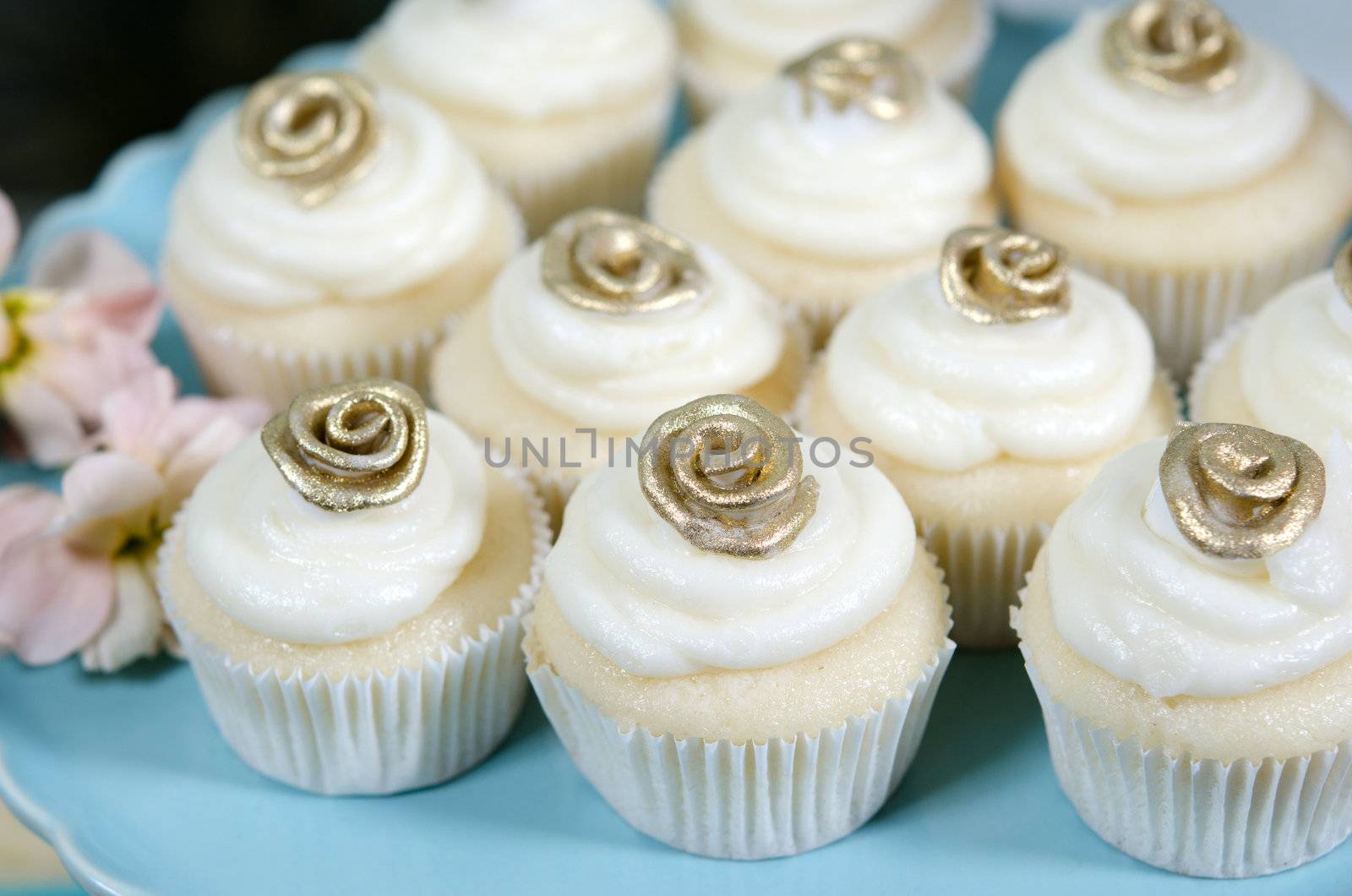 Image of beautifully decorated wedding cupcakes on a plate