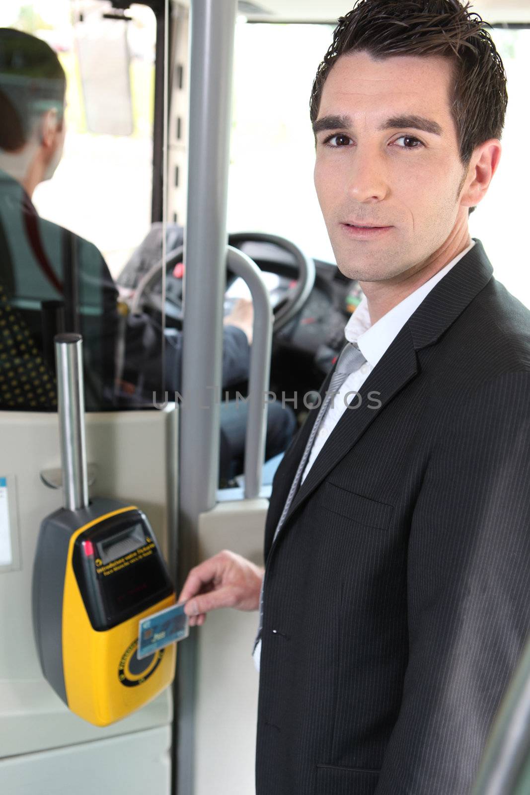 portrait of a man in public transportation by phovoir