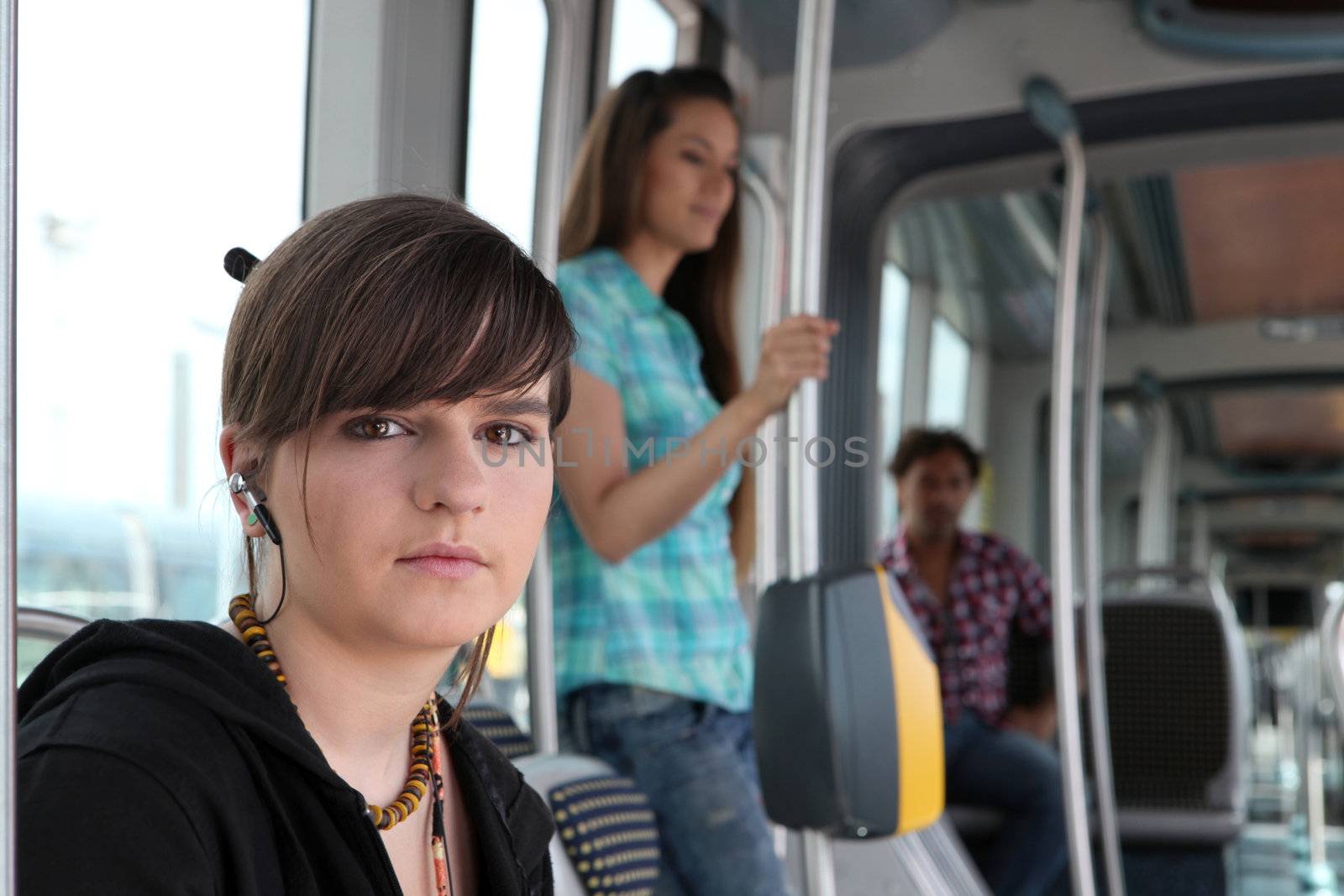 Young woman on a tram by phovoir