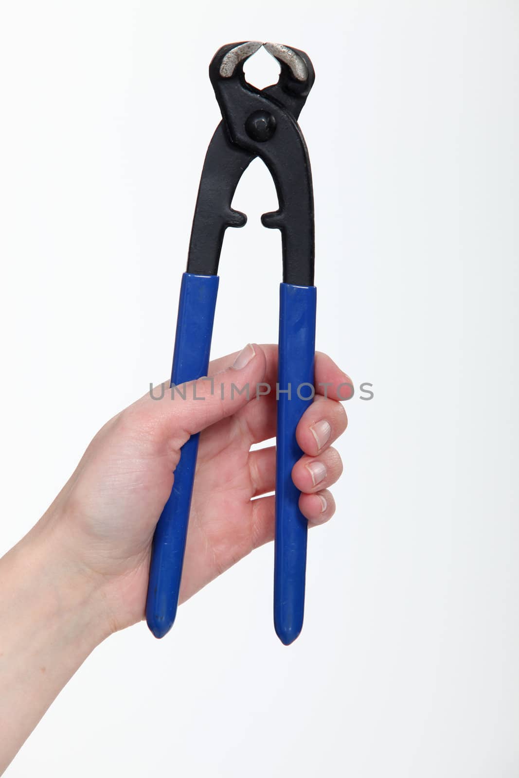 hand holding spanner by phovoir