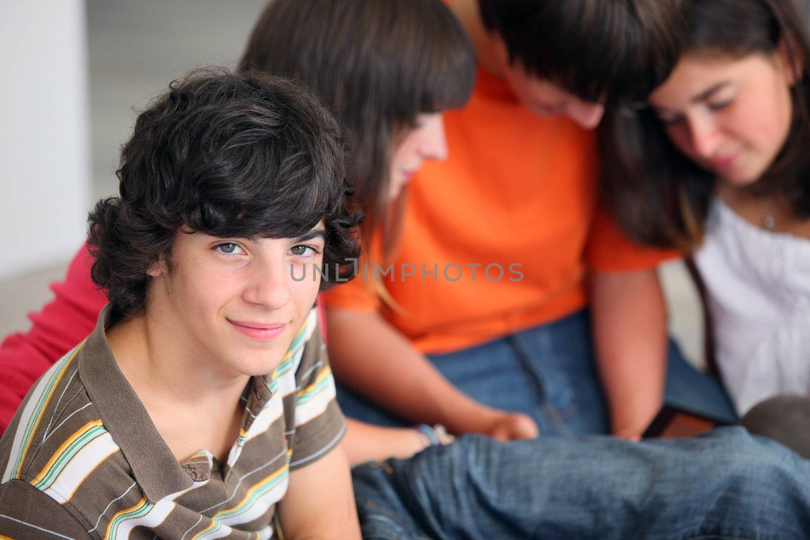 Portrait of teenager with his friends by phovoir