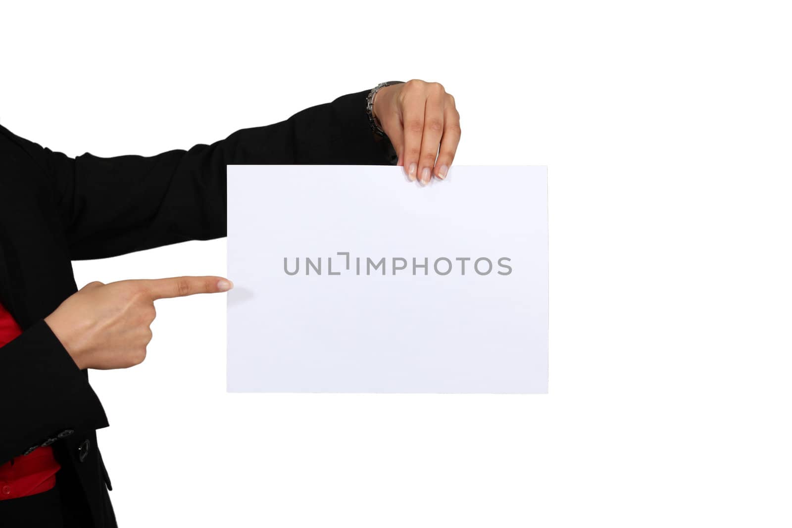 hand pointing at white sheet of paper
