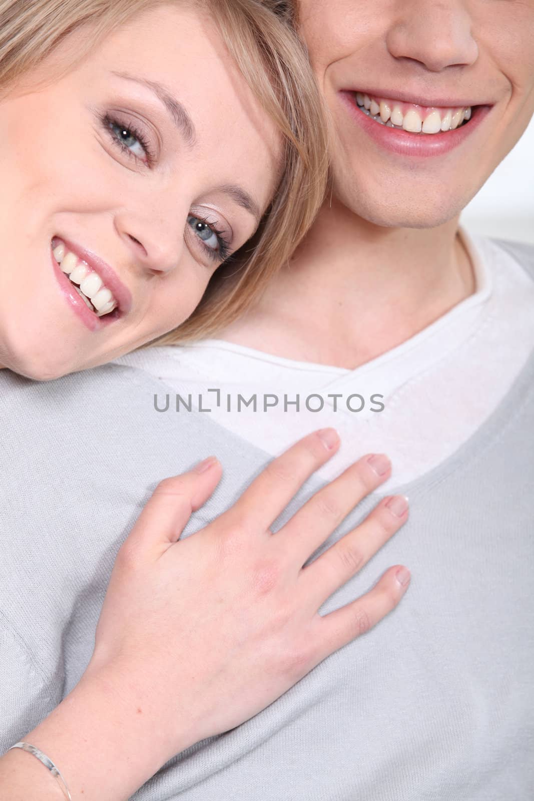 Smiling young couple by phovoir