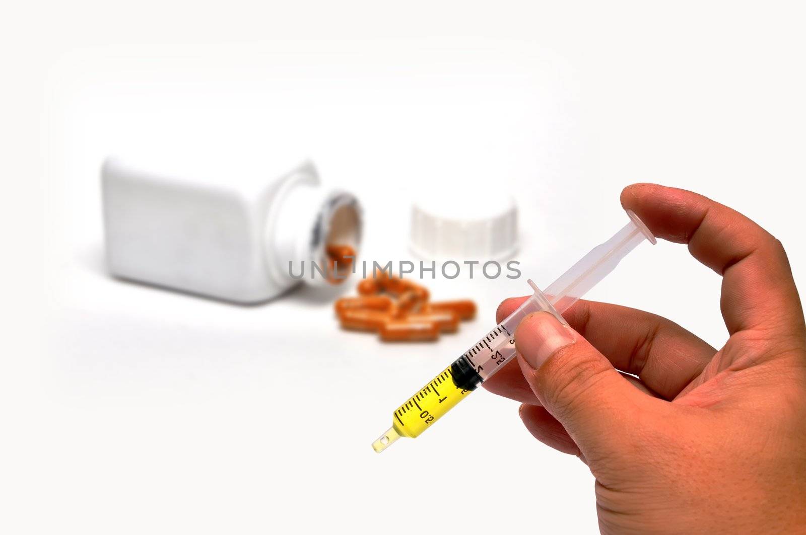 Syringe and hand