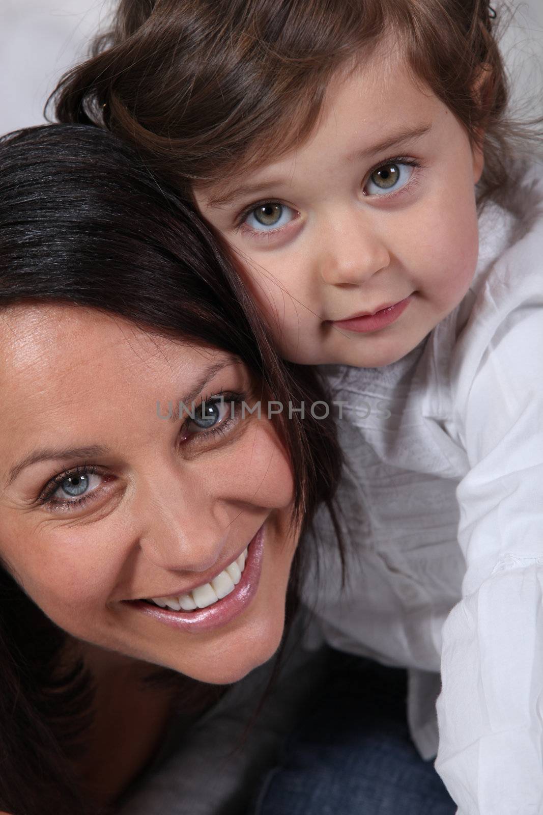 Portrait of little girl and her mum by phovoir