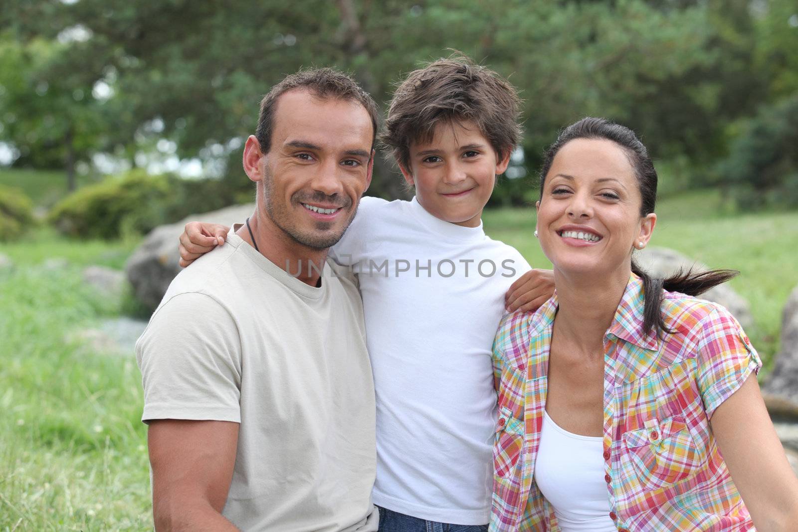 parents and their son on mountain walk by phovoir