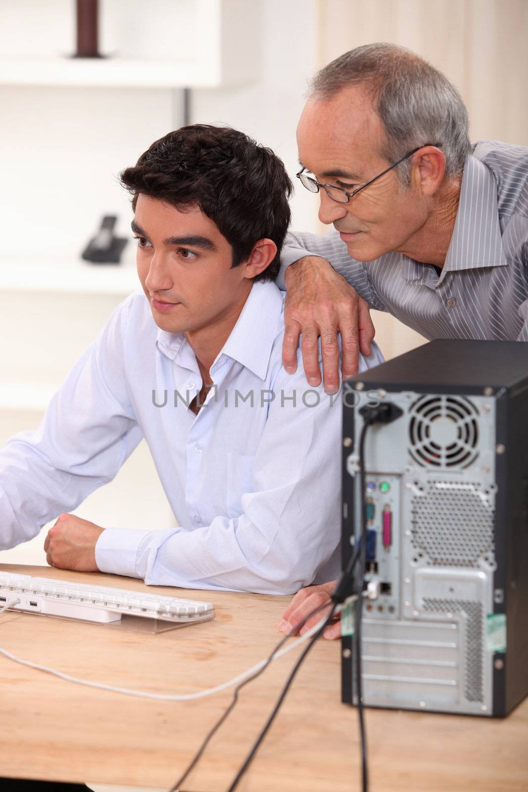 Father and son on the computer.