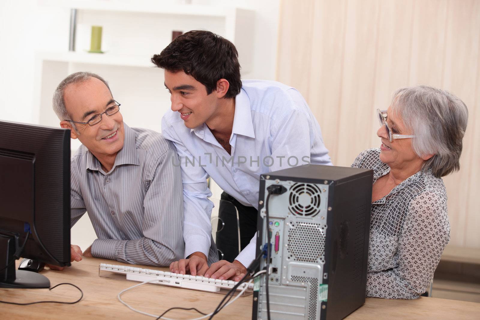 elderly couple in front of a computer by phovoir