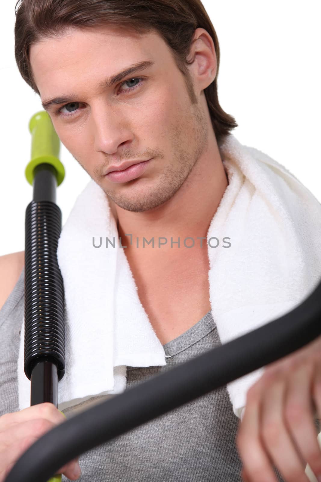 Sporty man in gym club by phovoir