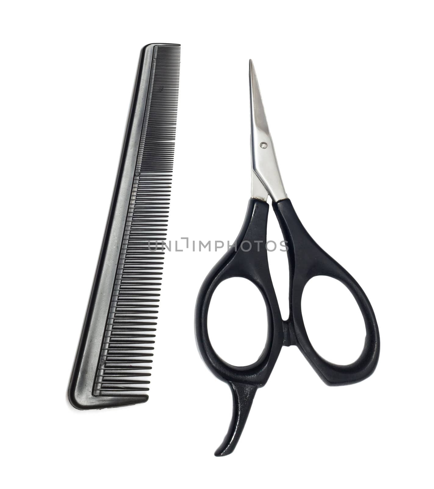 Scissors and comb isolated on white background 