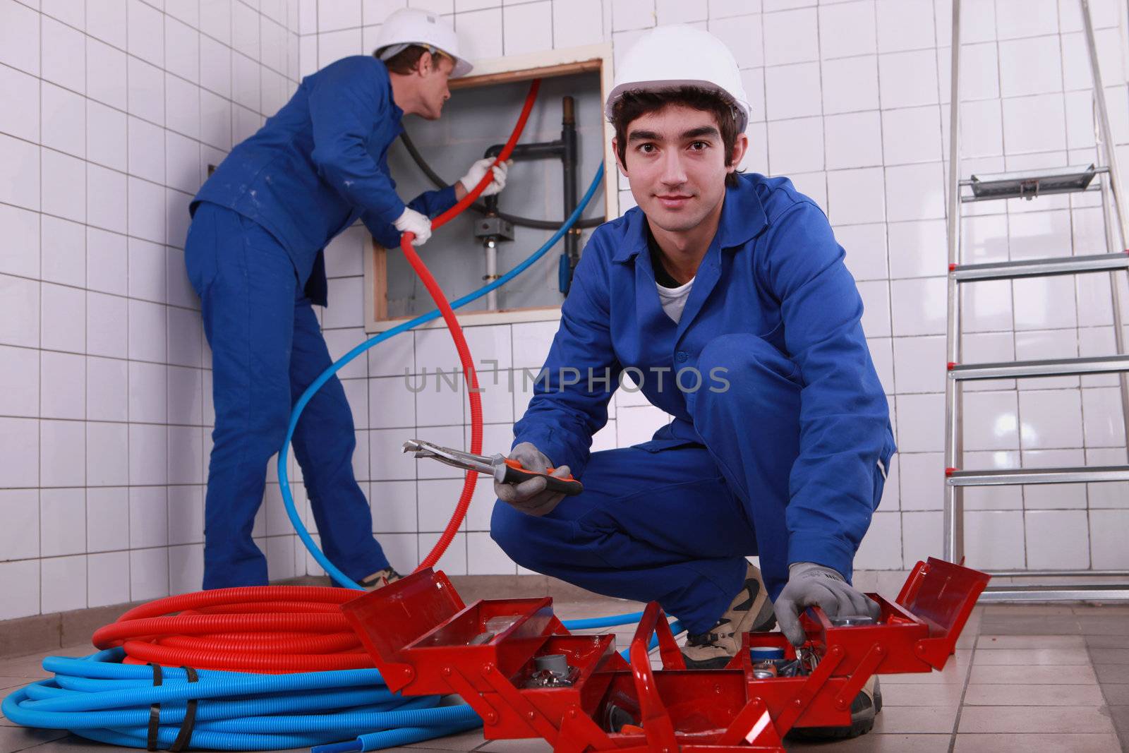 Plumbing team with a toolbox