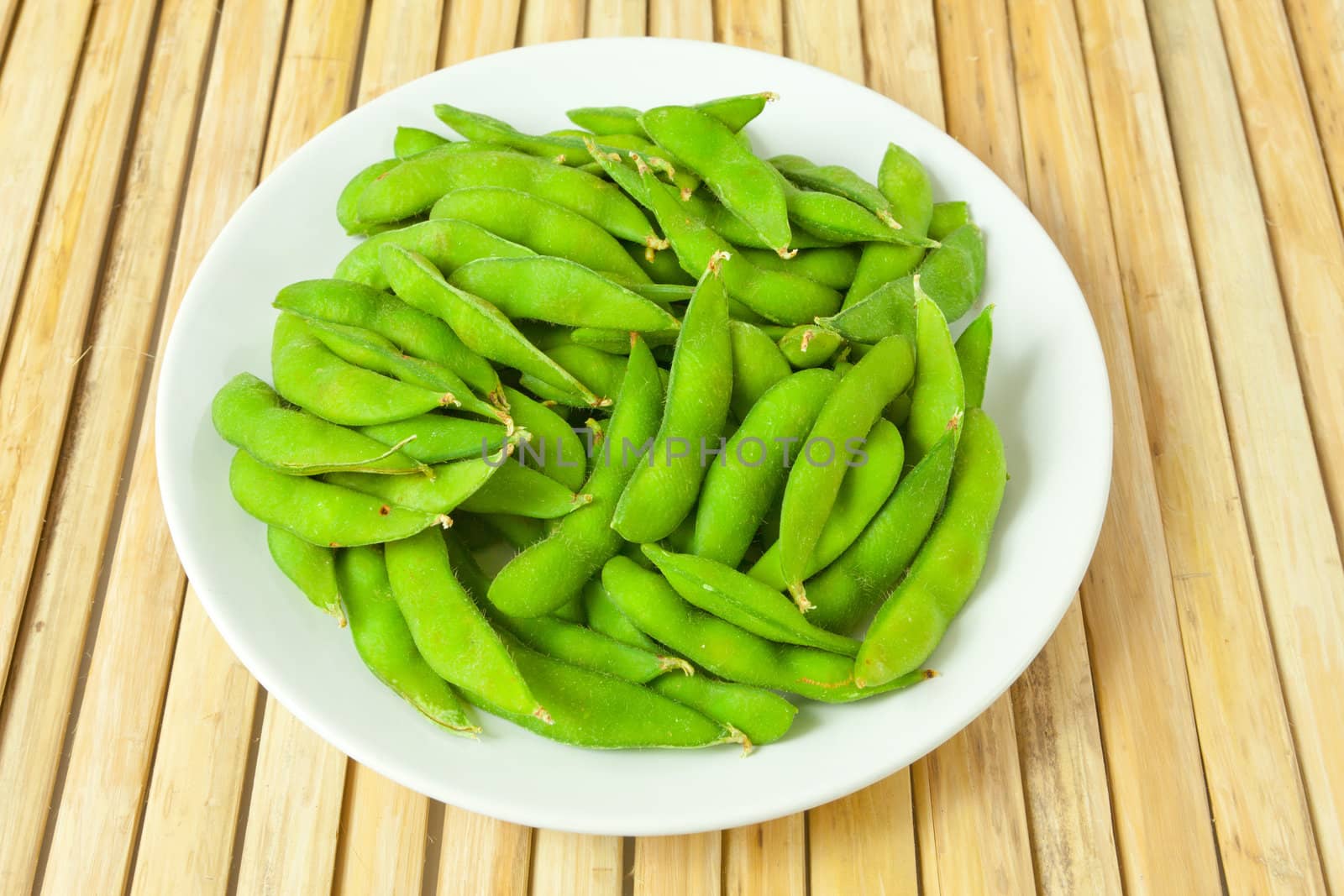 green bean vegetable on wood background