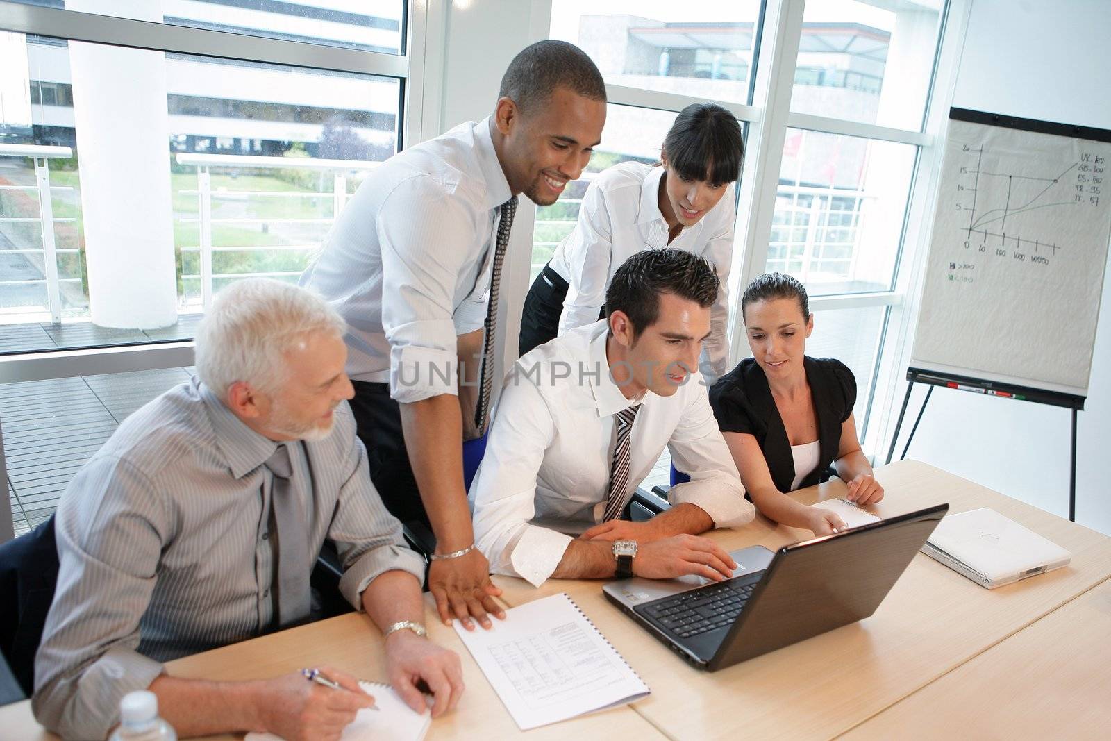 Business team looking at financial report on-line