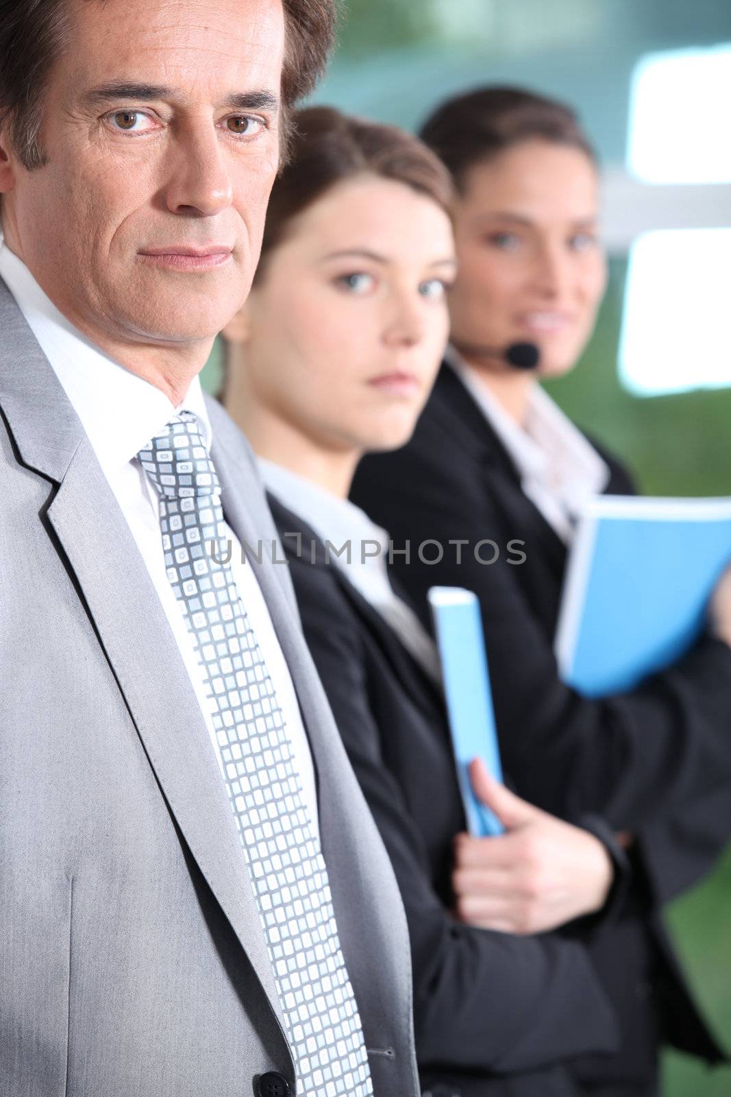 Male manager and his female team by phovoir