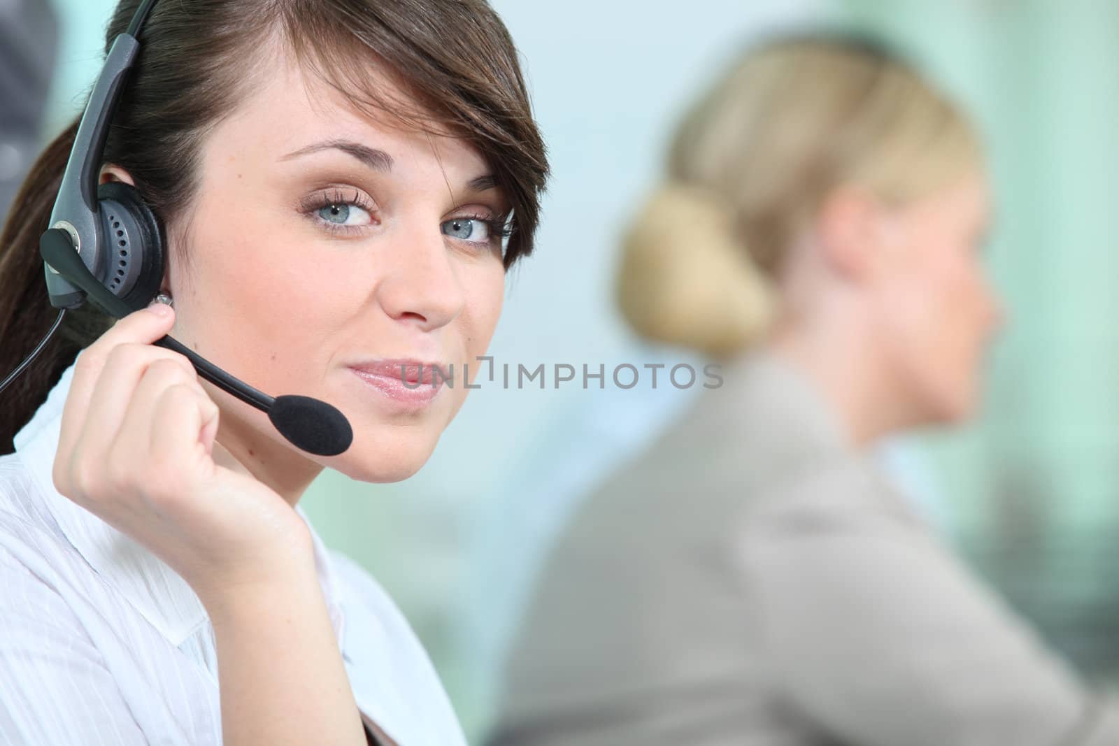 portrait of a woman with headset by phovoir