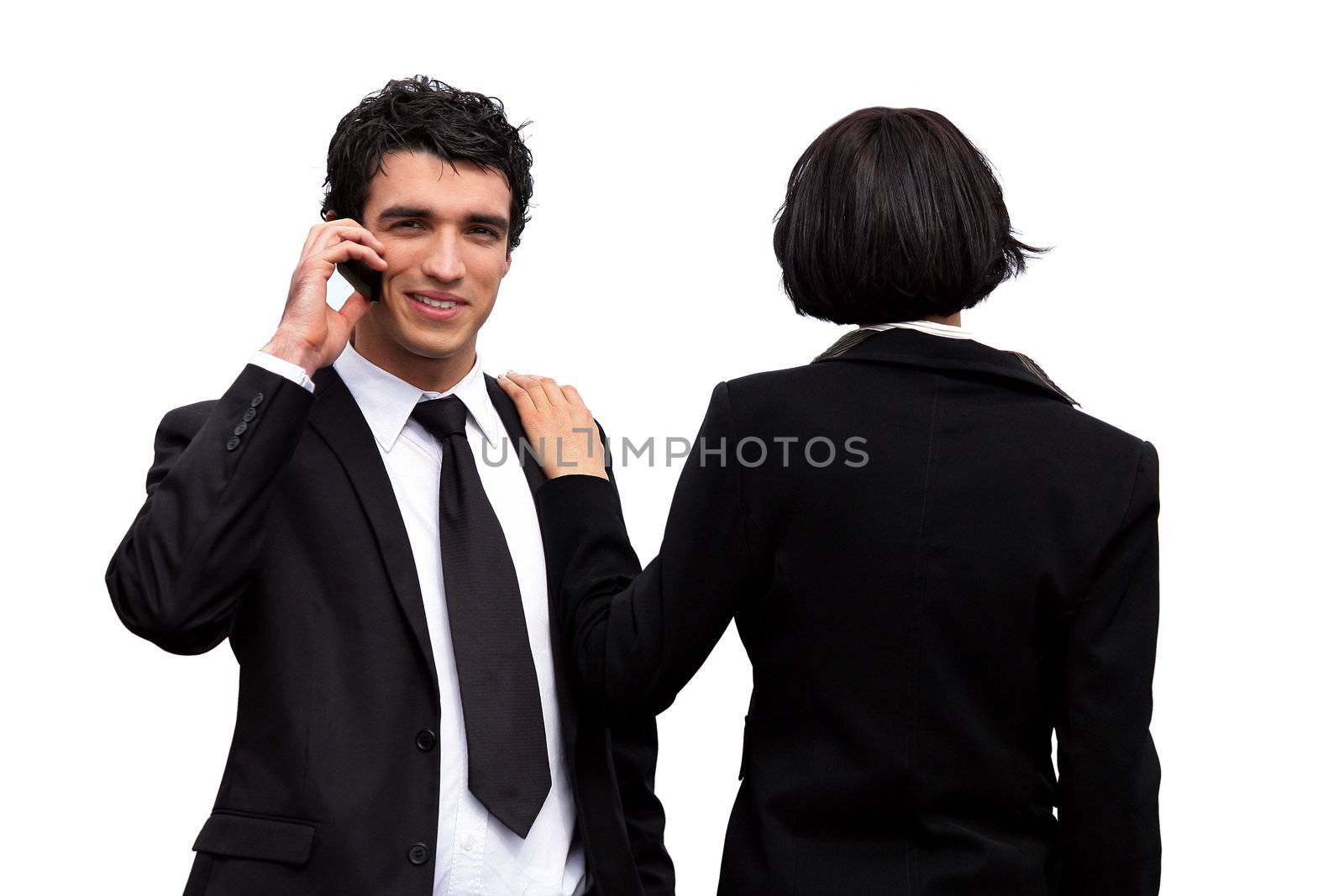 Young business couple making sales calls by phovoir