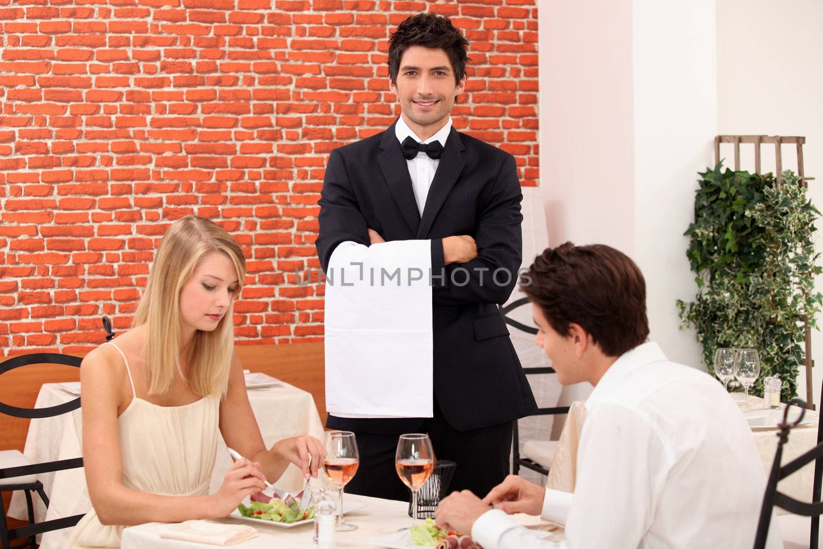 Couple enjoying romantic meal by phovoir