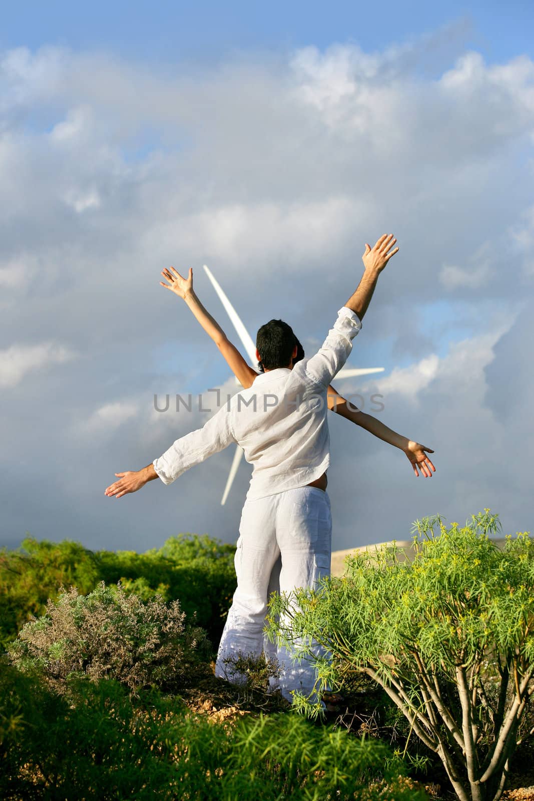 people imitating movements of a windmill