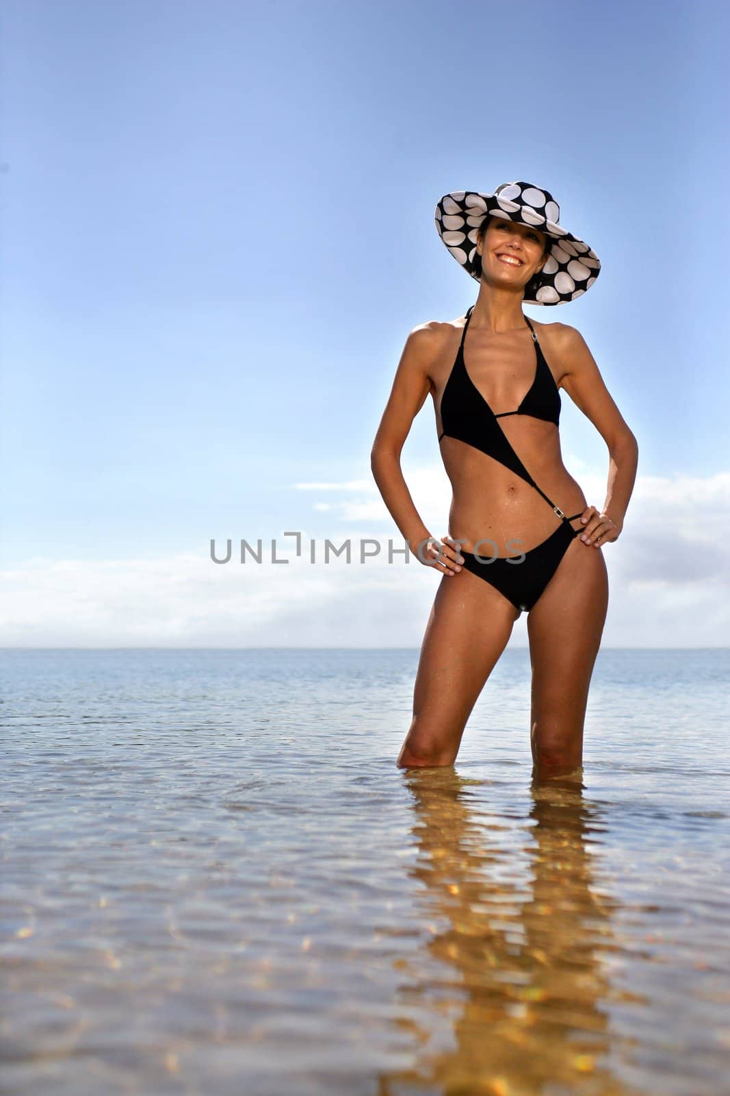 Stylish woman in a bikini by phovoir