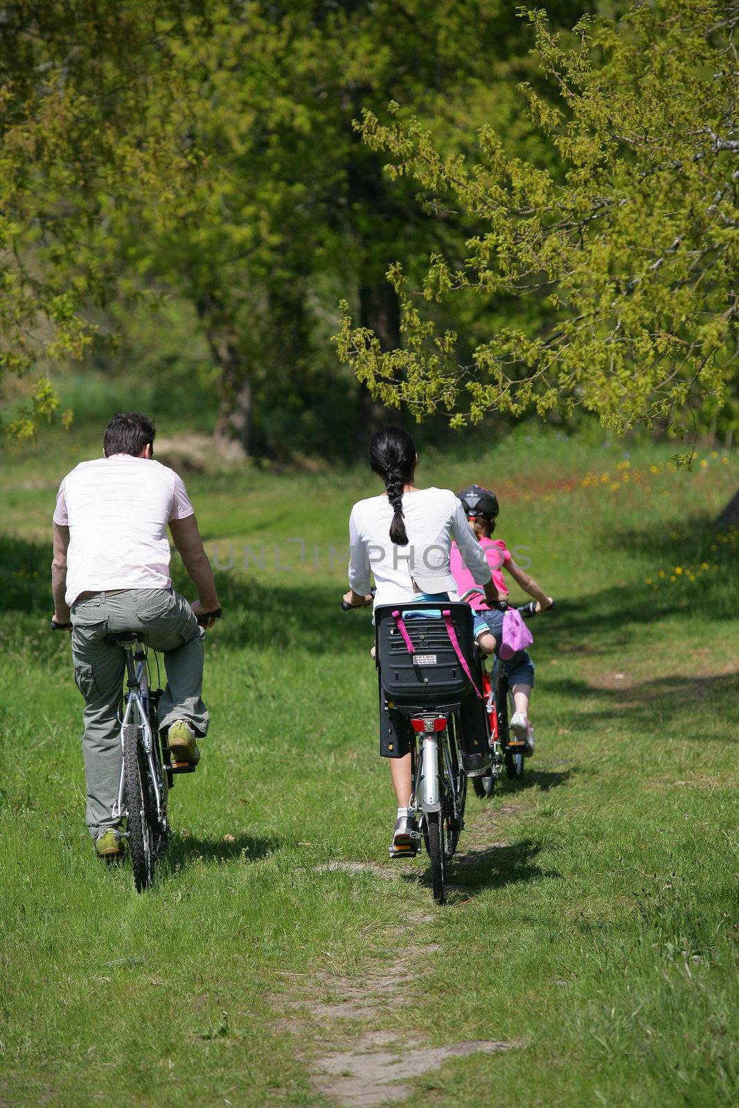 Family bike ride by phovoir