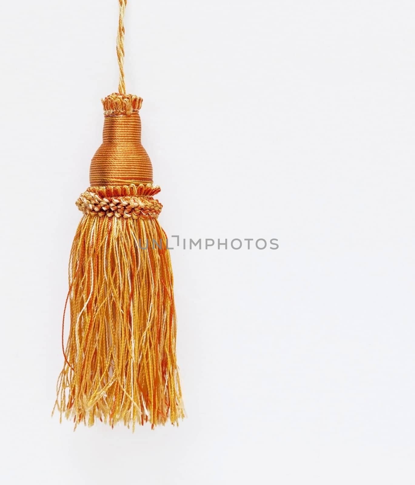 Gold christmas balls hanging on white background