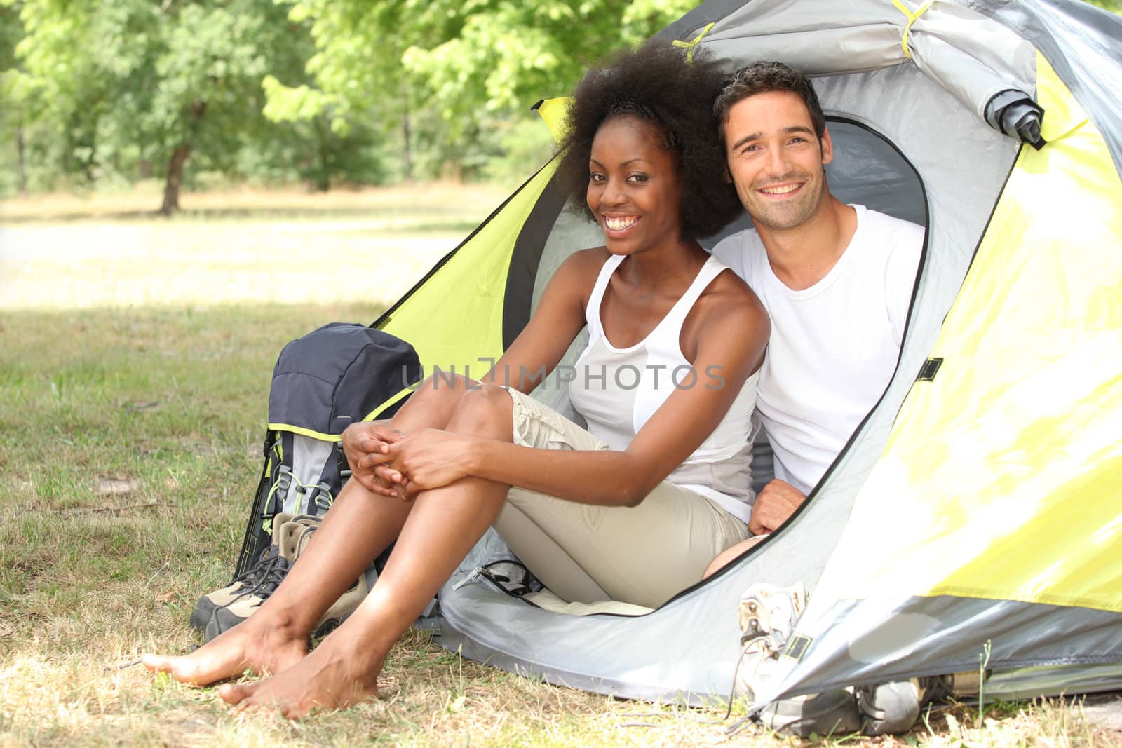 Couple sitting in a tent