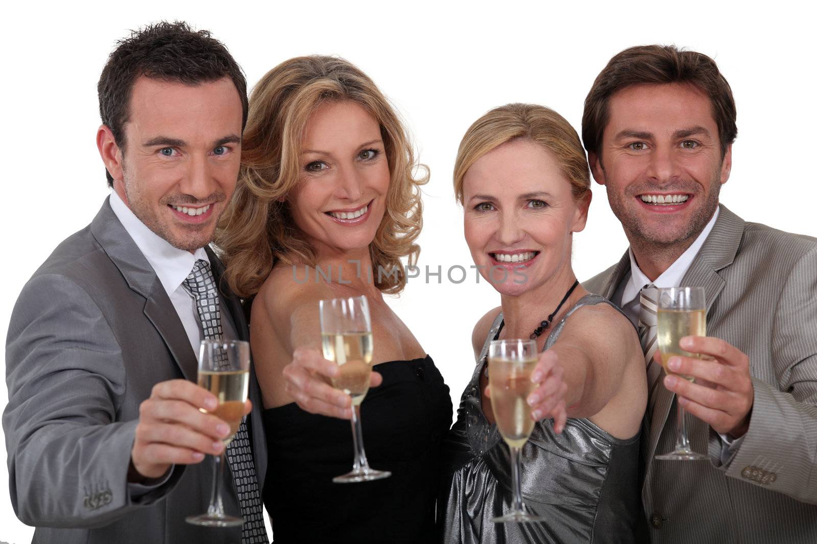 Four people toasting success