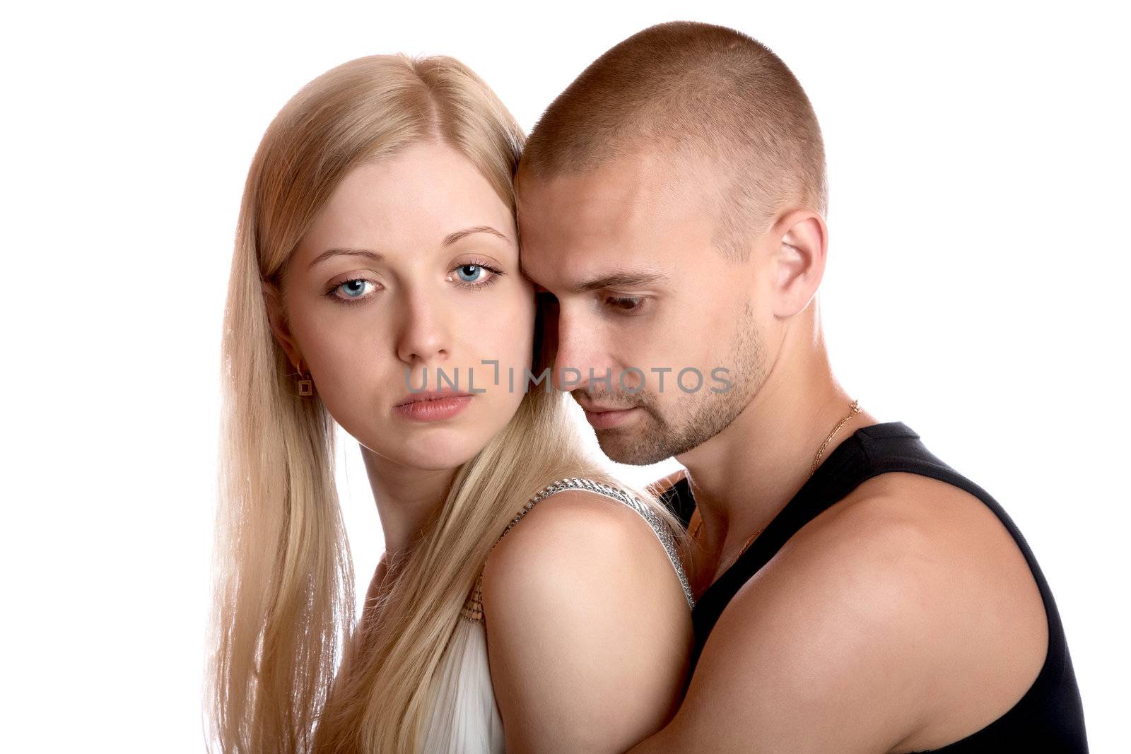 young man embraces the girl on a white background