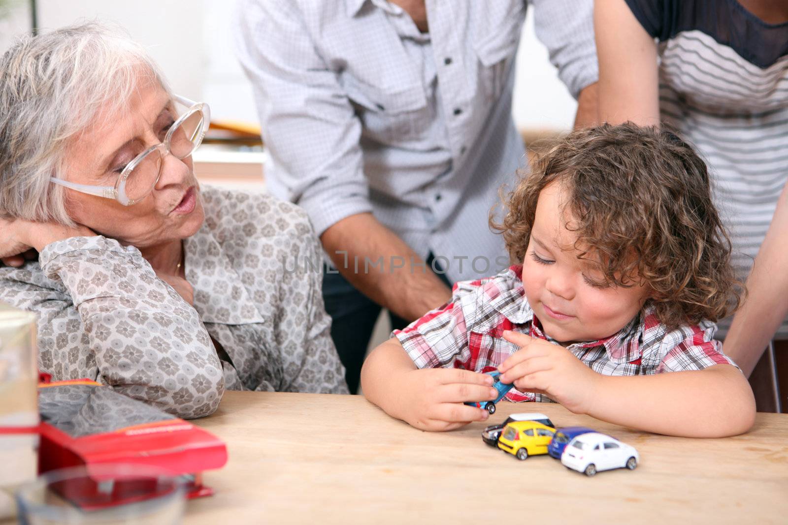 Little boy playing with toy cars