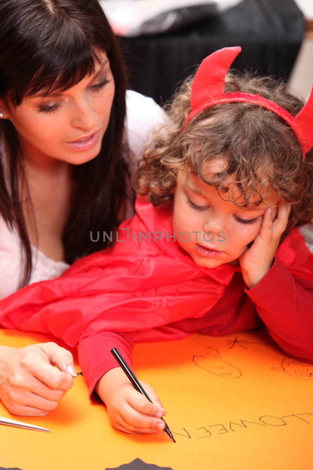 A mother and her son getting ready for Halloween. by phovoir