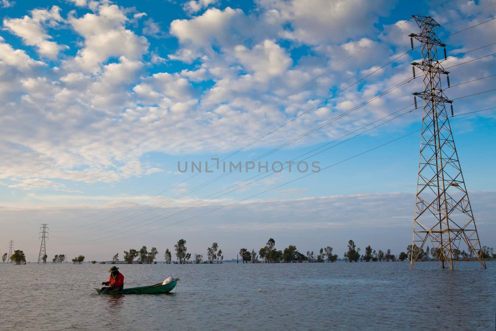 A fisherman with a boat on the flood in Thailand