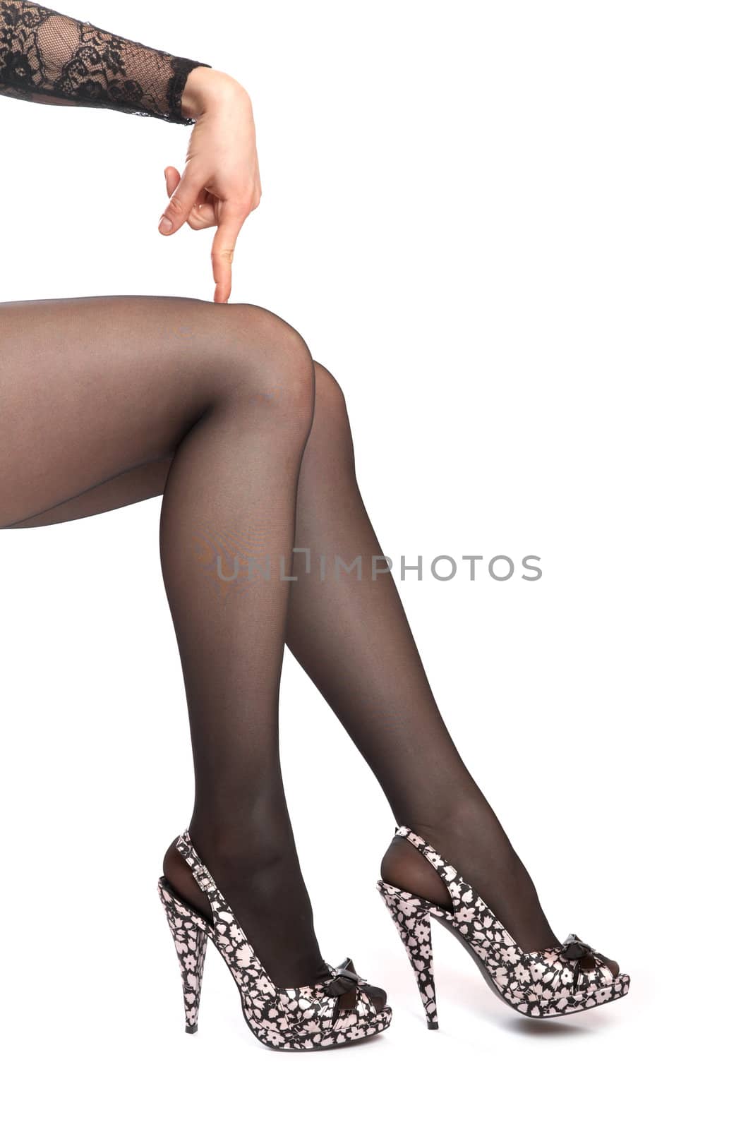 Hand of the girl and foot in shoes on a high heel   white background