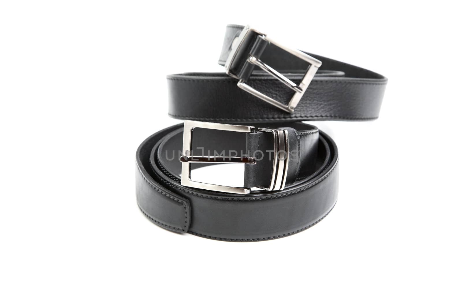 Two man's black belts on a white background