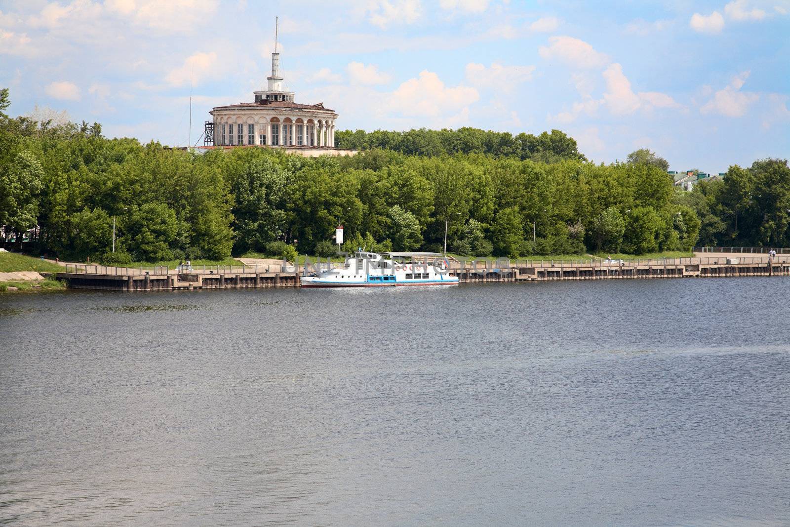 Landscape with steamship and river station in the afternoon