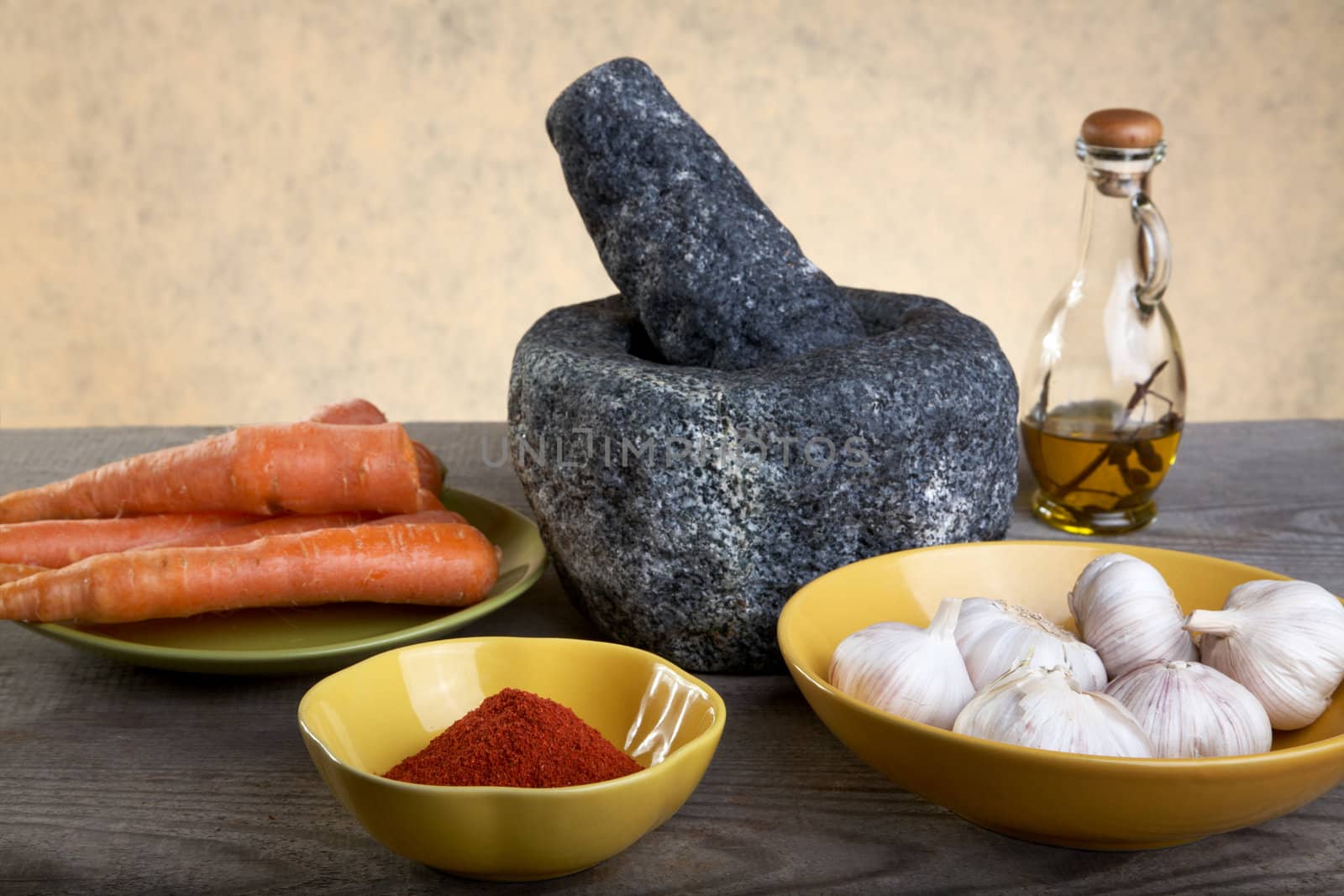 Stone mortar and spices on a wooden table