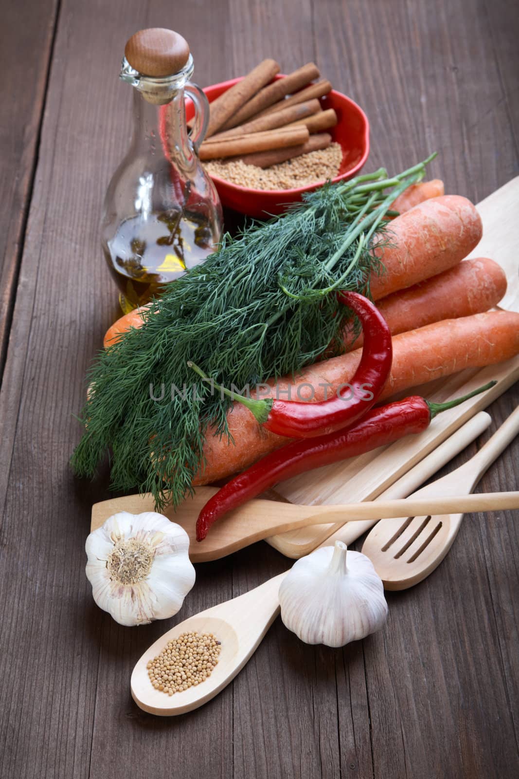 Spices and vegetables on an old wooden table