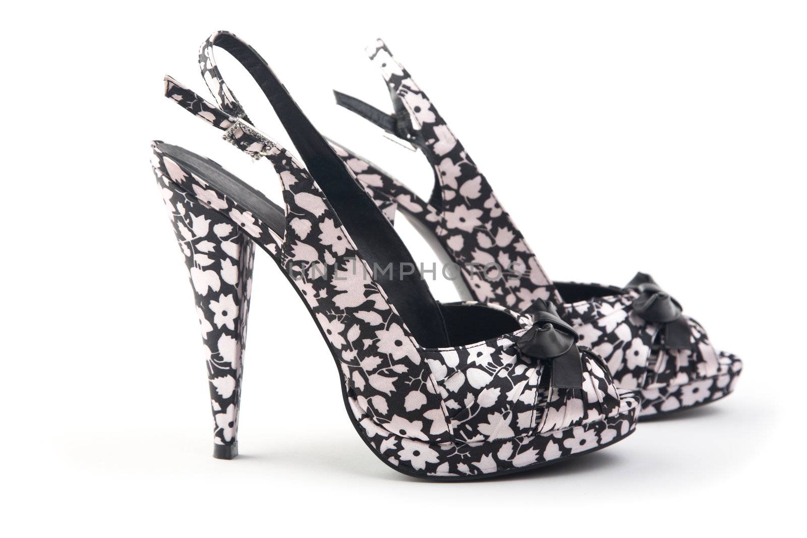 pair of female shoes on a high heel  white background