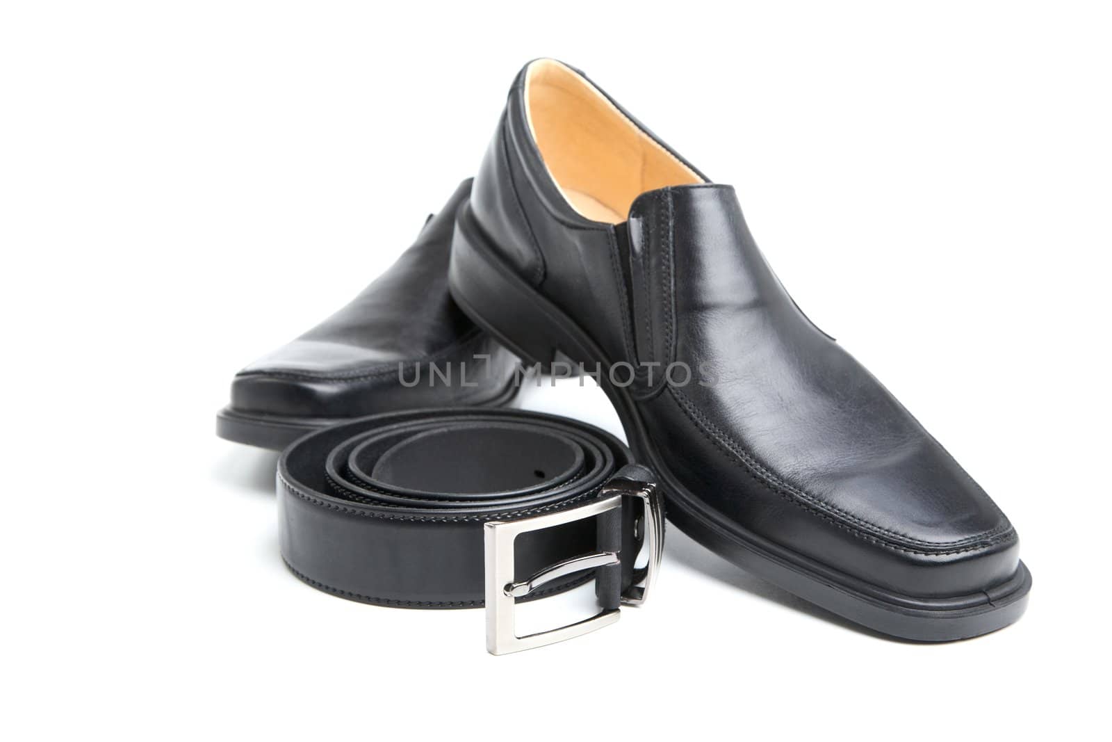 pair black man's shoe and a belt on  white background