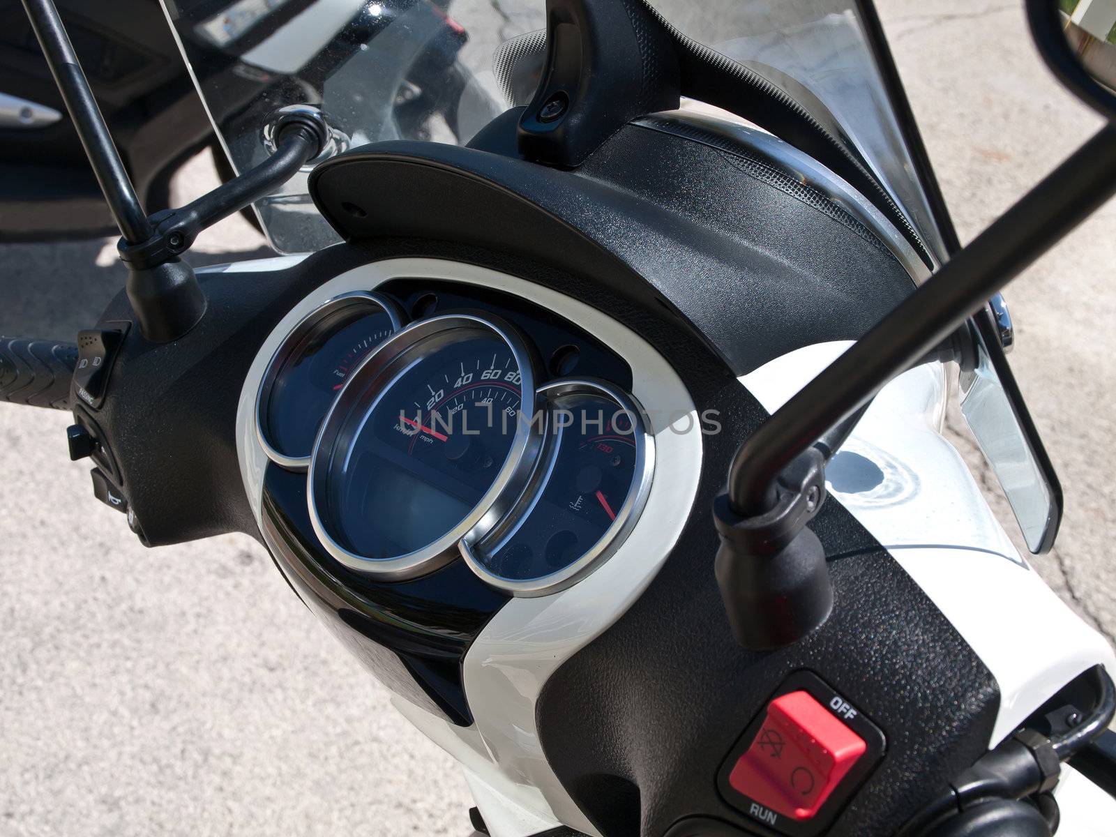 handlebar and speedometer on shiny modern scooter