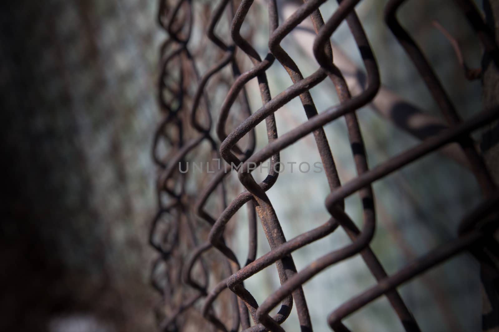 a rusty iron fence mesh