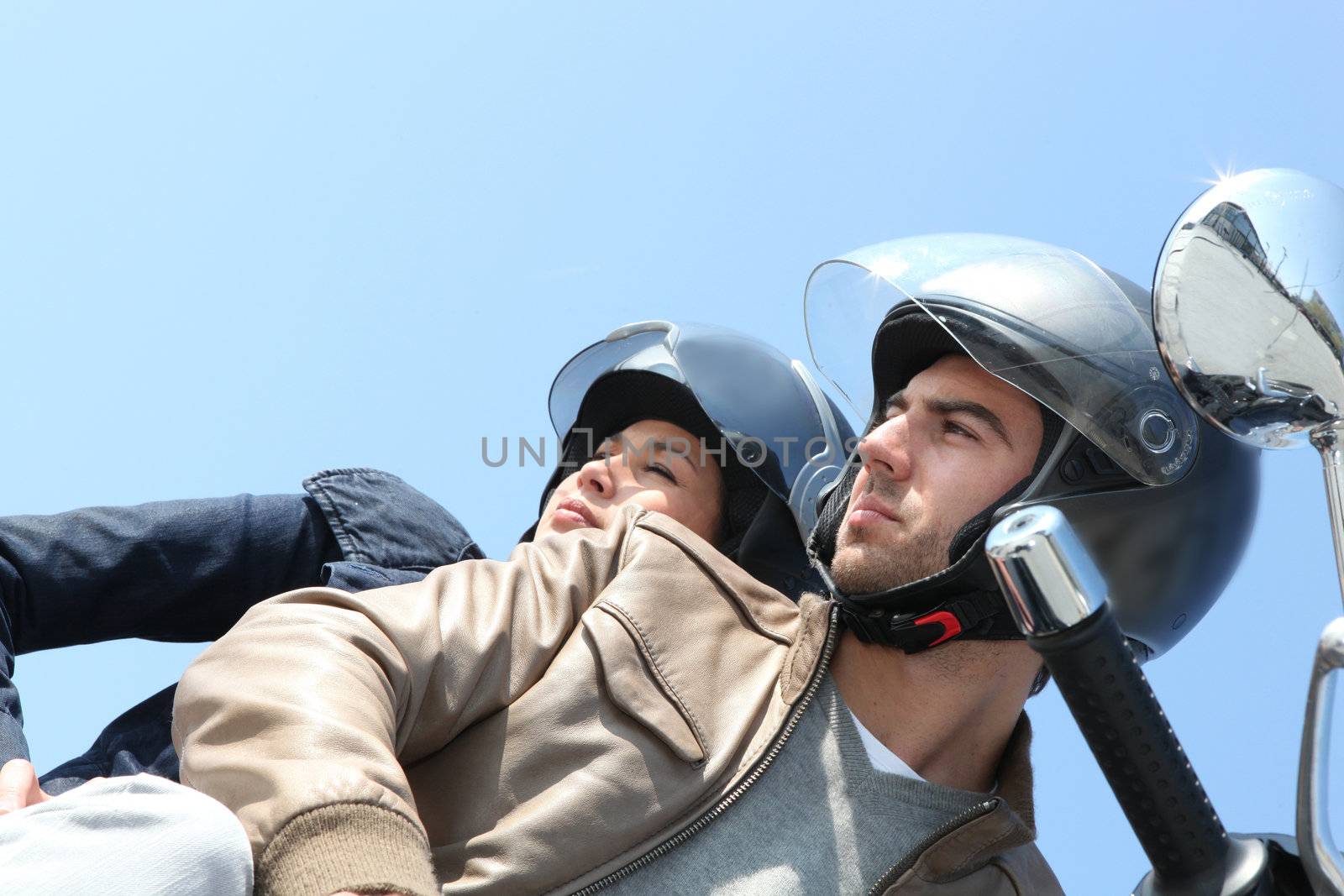 Couple on a scooter outdoors