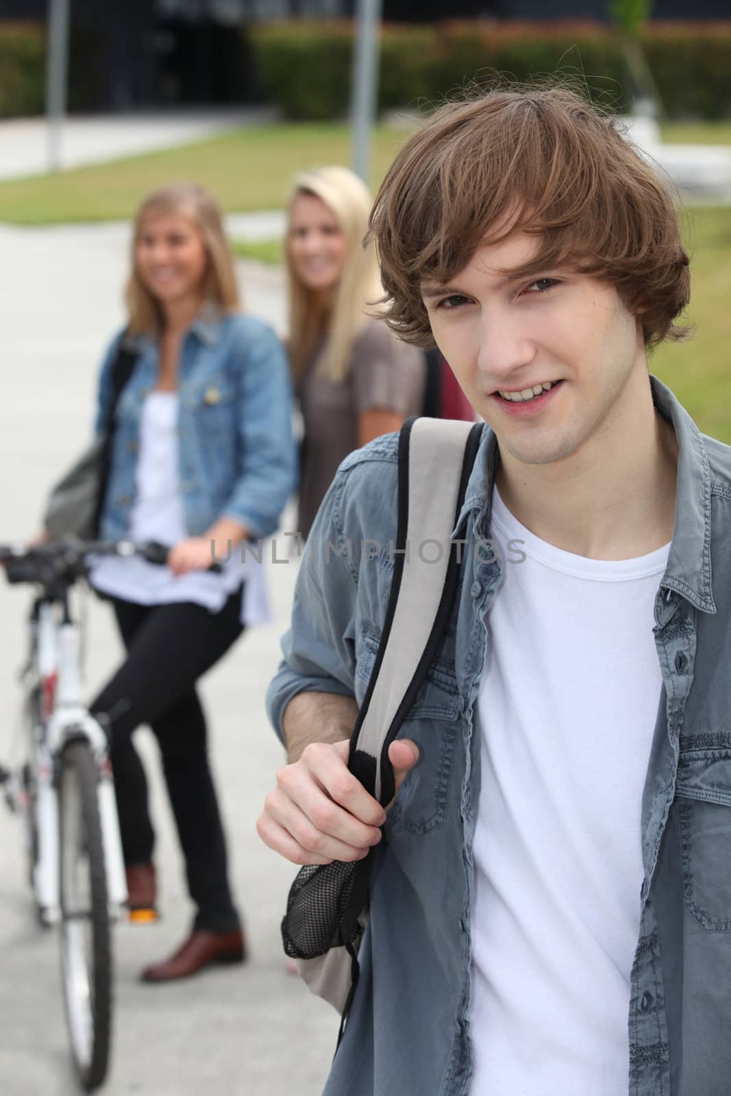 Three teenagers arriving at college by phovoir