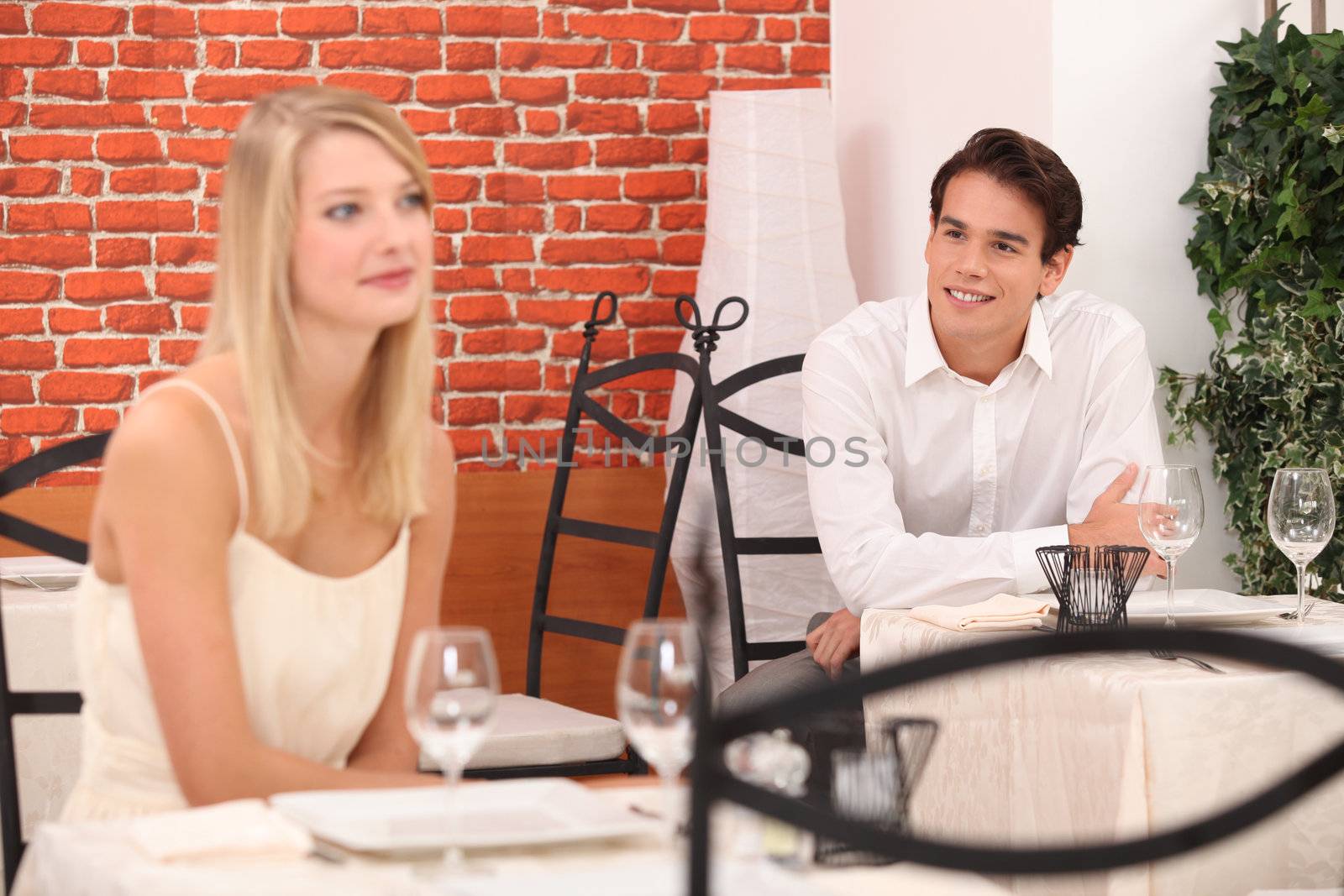 Man observing pretty lady in a restaurant