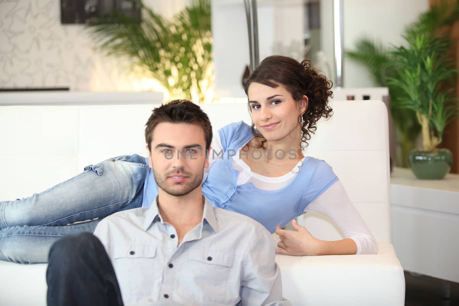 Couple relaxing in living room