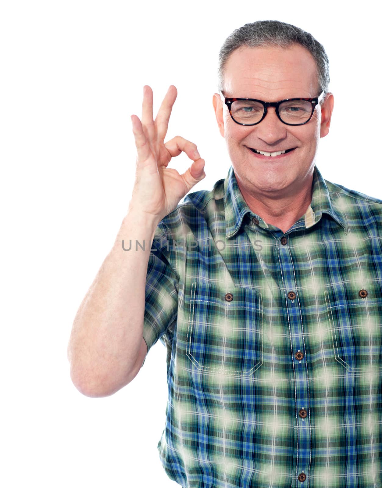 Closeup of a aged man gesturing an excellent job done sign. Smiling