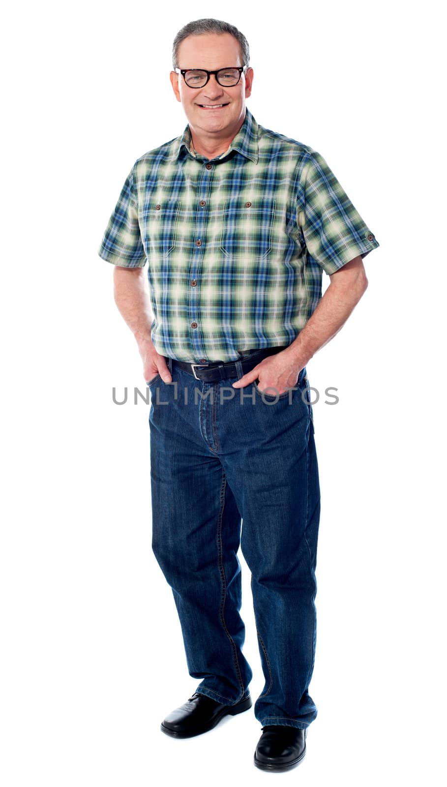 Joyful senior man posing casually with hands in pocket isolated on white