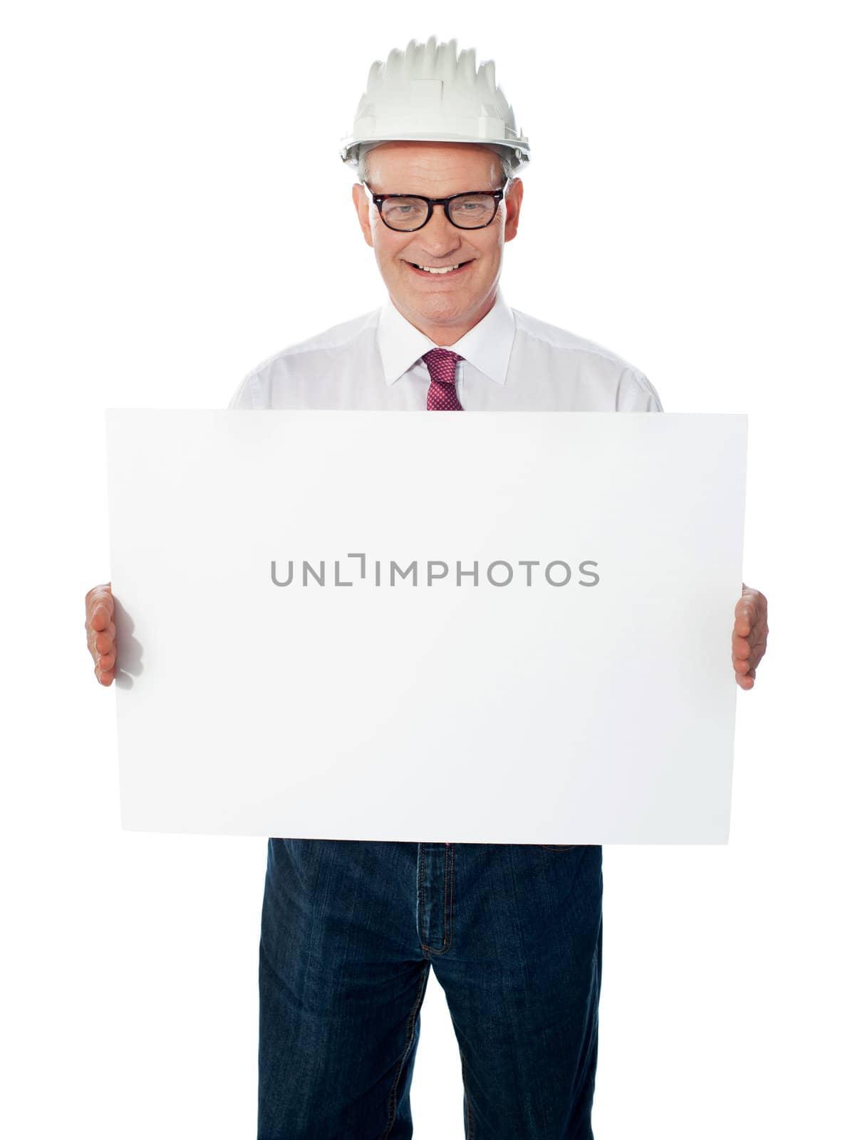 Businessman architect holding a blank white signboard by stockyimages