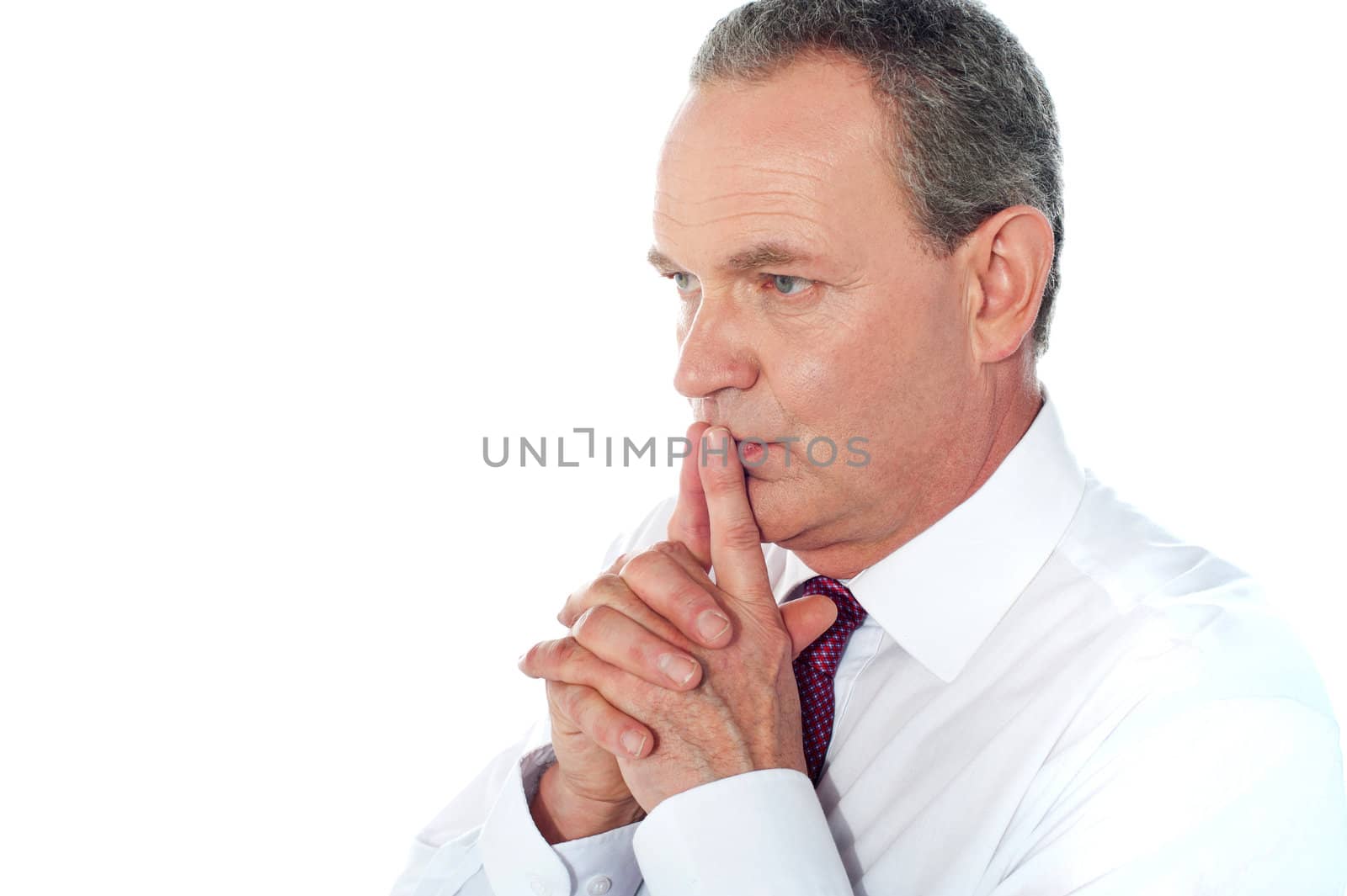 Portrait of thoughtful businessman by stockyimages