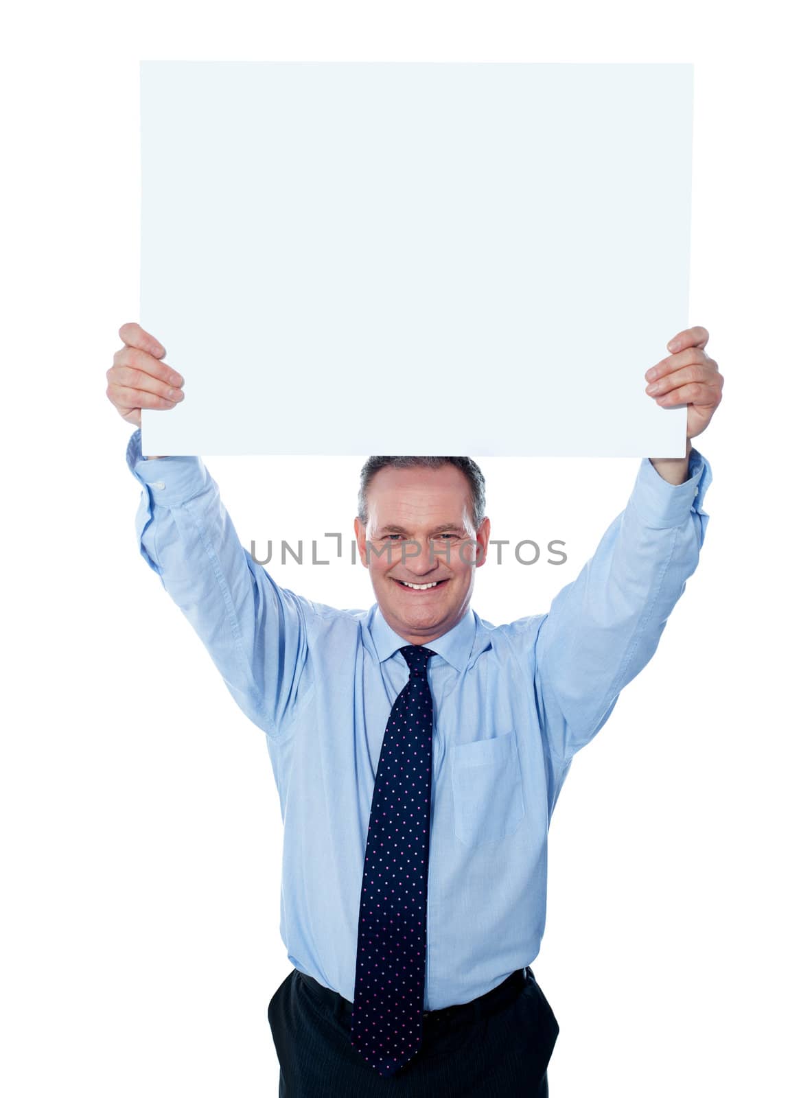 Businessman holding a blank billboard over the head by stockyimages