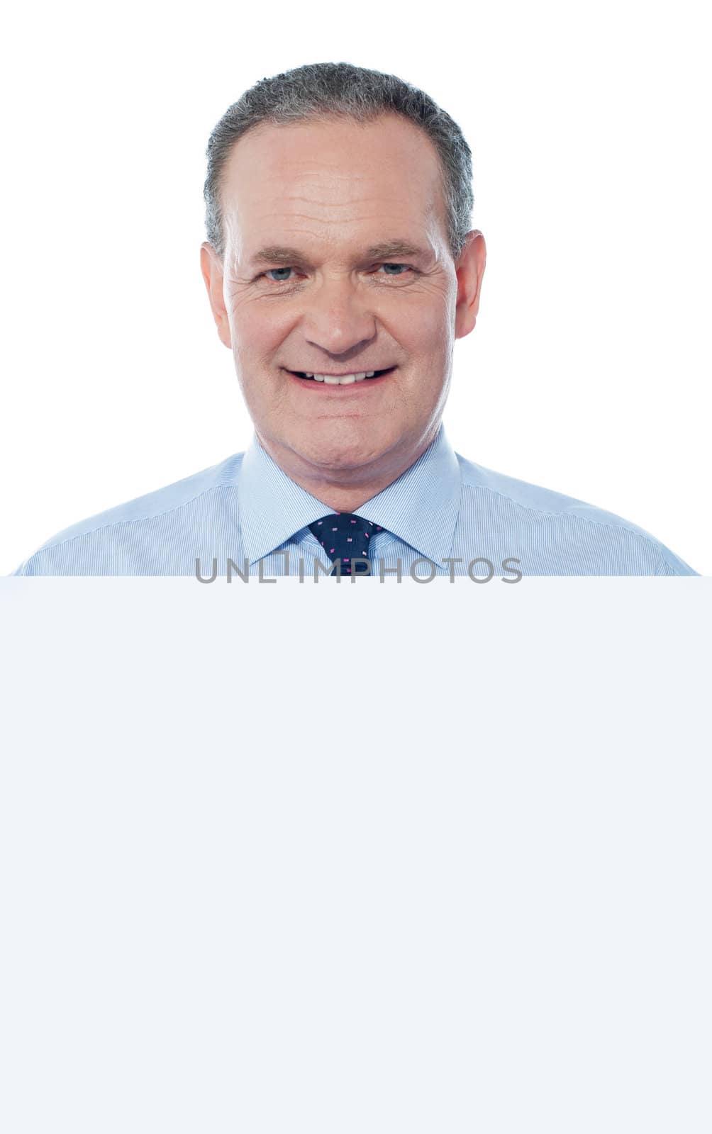 Senior business professiona displaying blank ad by stockyimages